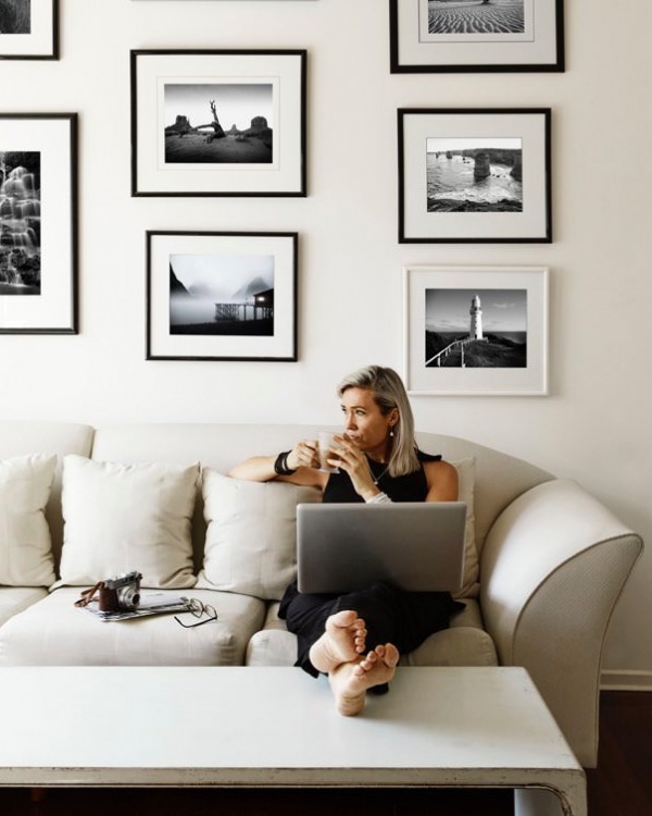 Woman sitting on sofa drinking coffee Woman sitting on sofa drinking coffee